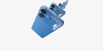 Nothing Phone (4b) in blue with dual cameras and Glyph Bar