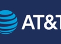 AT&T logo on navy background, marking the carrier's $23 billion EchoStar 5G spectrum acquisition