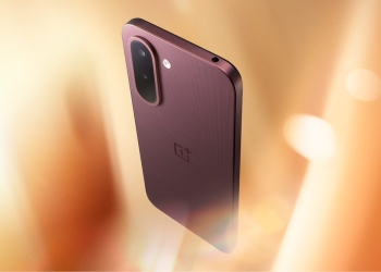 OnePlus N6x in Burgundy Red held at an angle, showing the textured rear panel and capsule camera island