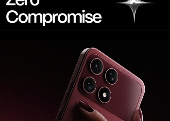 boltt Ace 5G held in hand showing its burgundy rear panel and square camera module