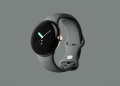 Original Google Pixel Watch in gold with a grey band, shown against a grey background