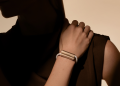 Luffu Link screenless LTE health and safety band in halo gold worn on a wrist