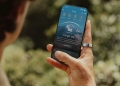 Oura Ring 4 worn on a finger next to the Oura app showing a readiness score