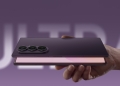 Samsung Galaxy Z Fold8 Ultra held folded in one hand, showing its triple rear camera module