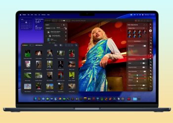 Apple M5 MacBook Air in Midnight open on a yellow background