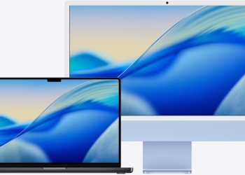 Space black MacBook Pro in front of a blue iMac on Apple's trade-in page