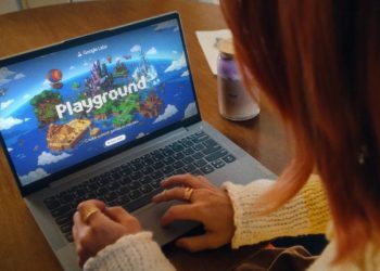 Google Labs Playground splash screen shown on a laptop while a person types