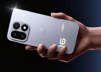 OnePlus 16 held in hand showing its rear camera module and glowing 16 design element